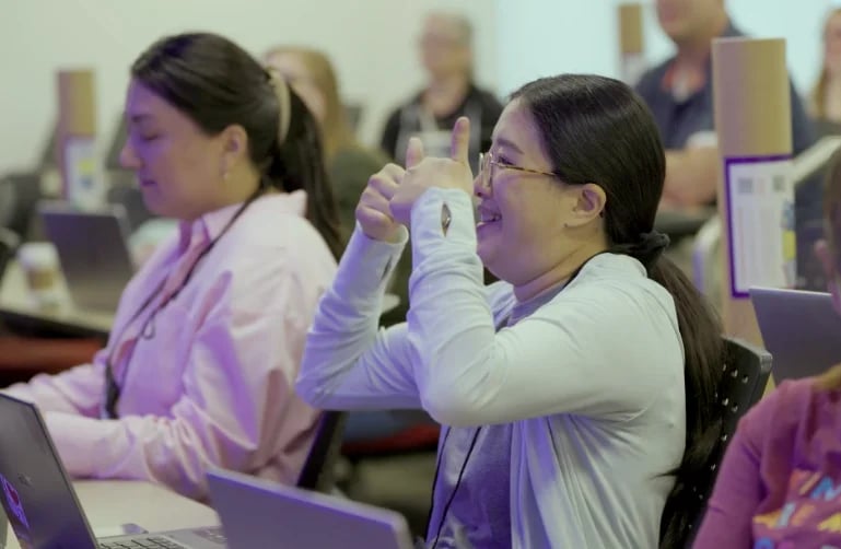 Students in classroom with device